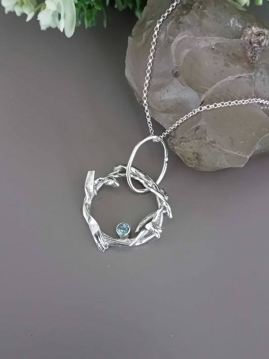 The Stork Nest Pendant - sterling silver with sky blue topaz