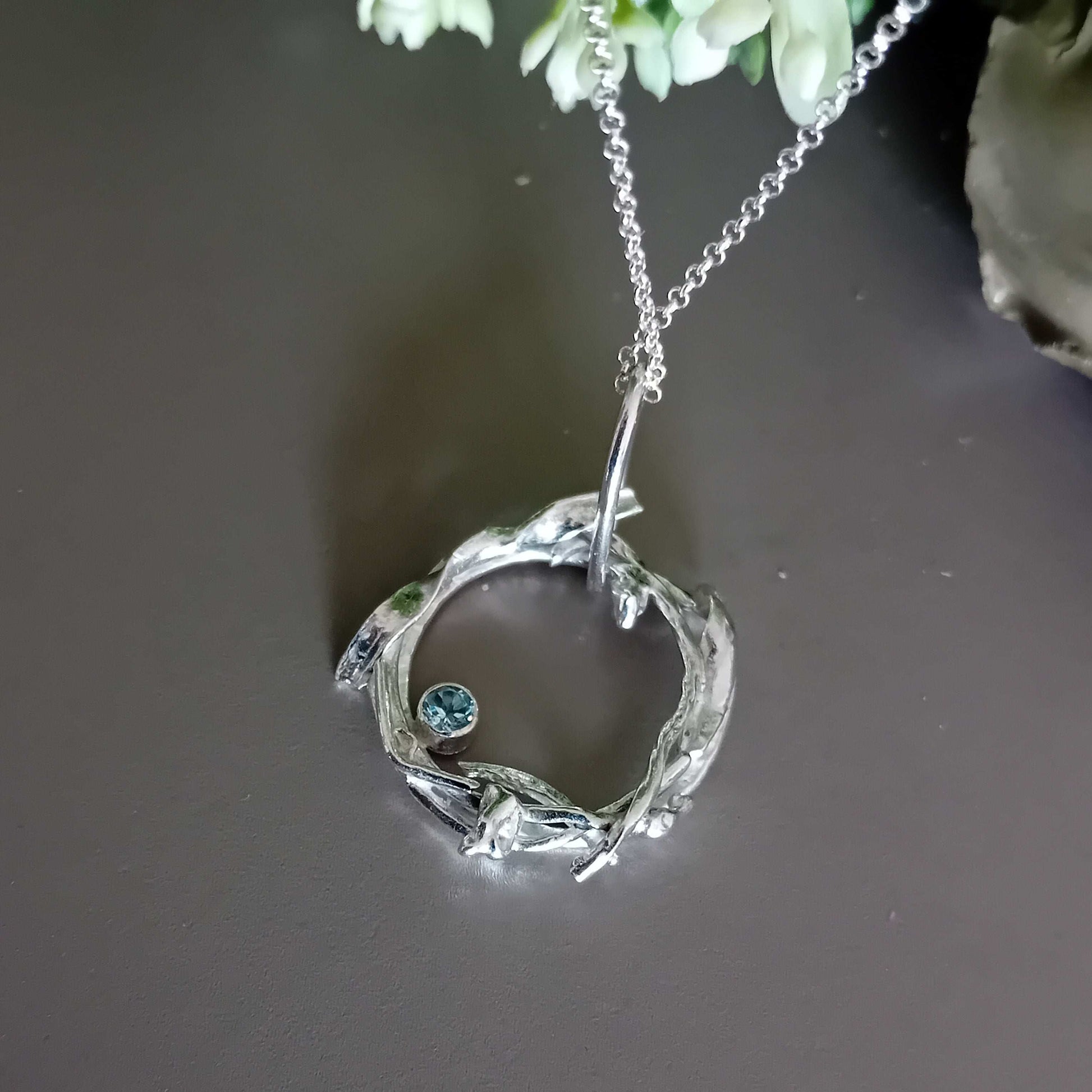 The Stork Nest Pendant - sterling silver with sky blue topaz